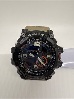 G-Shock Black Case with Tan Strap and Orange Dial Accent